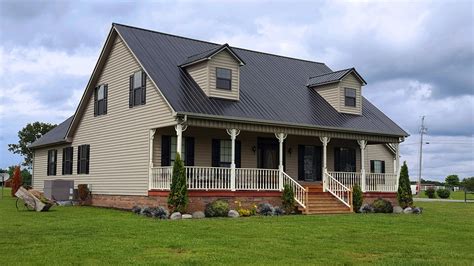 tan house with black metal roof|exterior house colors black roof.